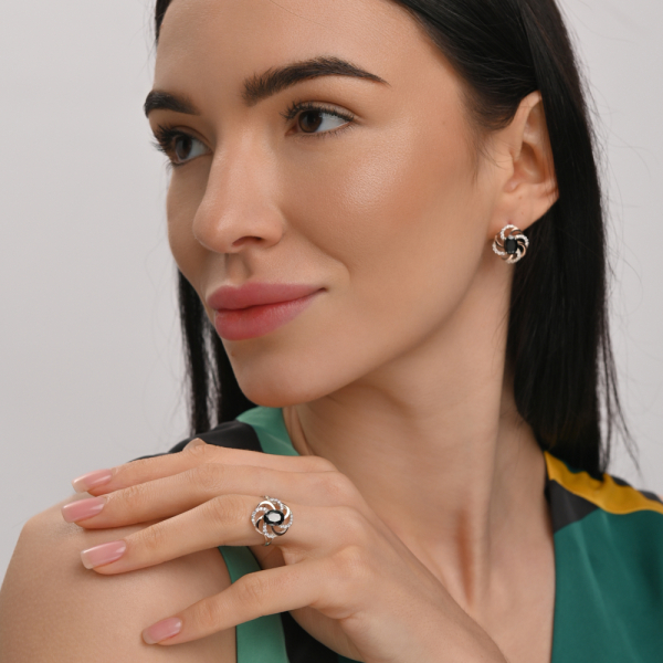 Срібна каблучка з золотими вставками