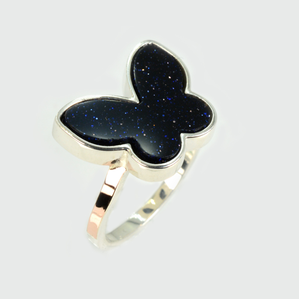 Срібна каблучка з золотими вставками